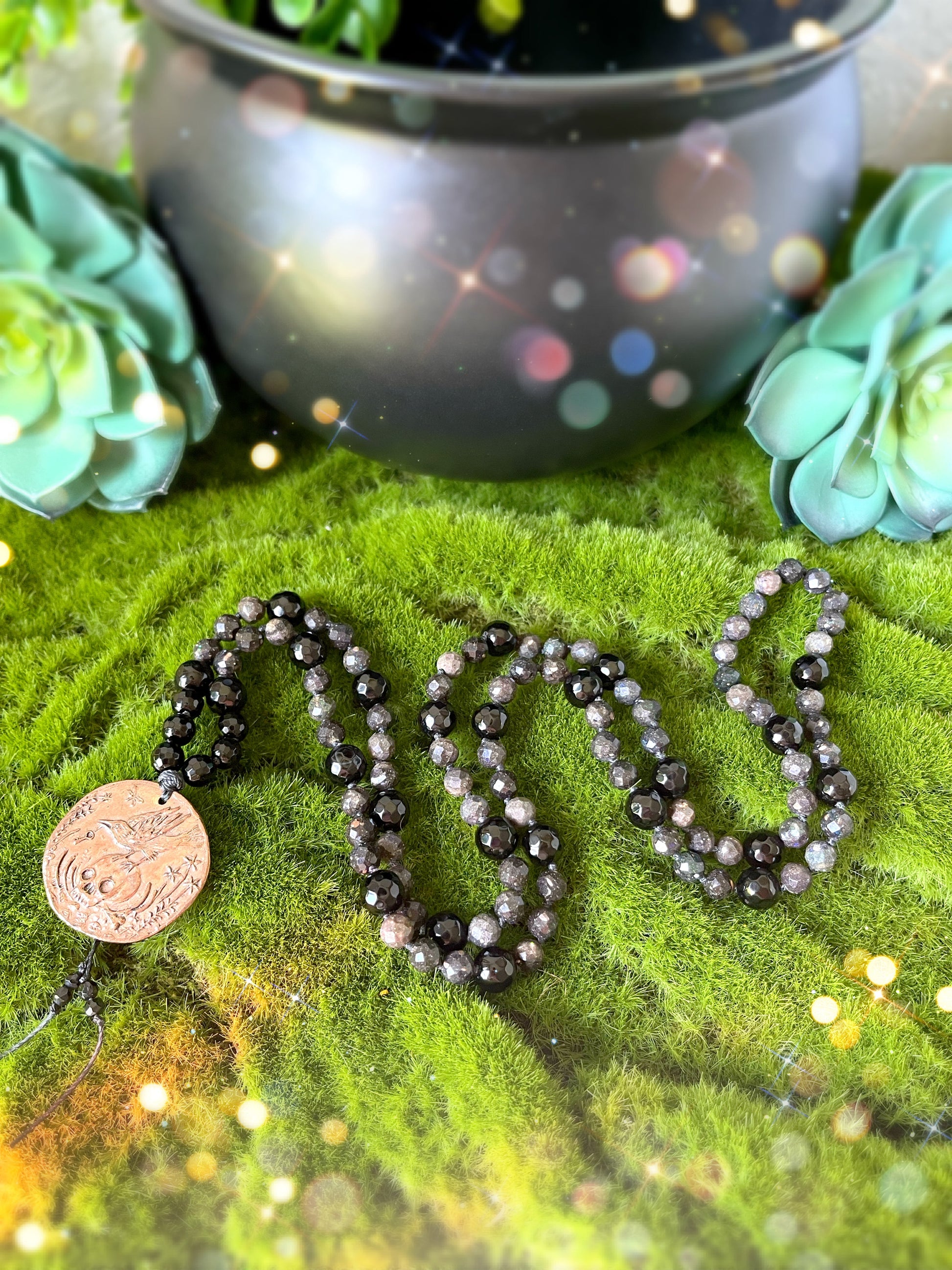 Nevermore Mala.  108 6mm beads of Black Opal, 8mm Faceted Black Tourmaline and finished with a Bronze skull and raven pendant. 